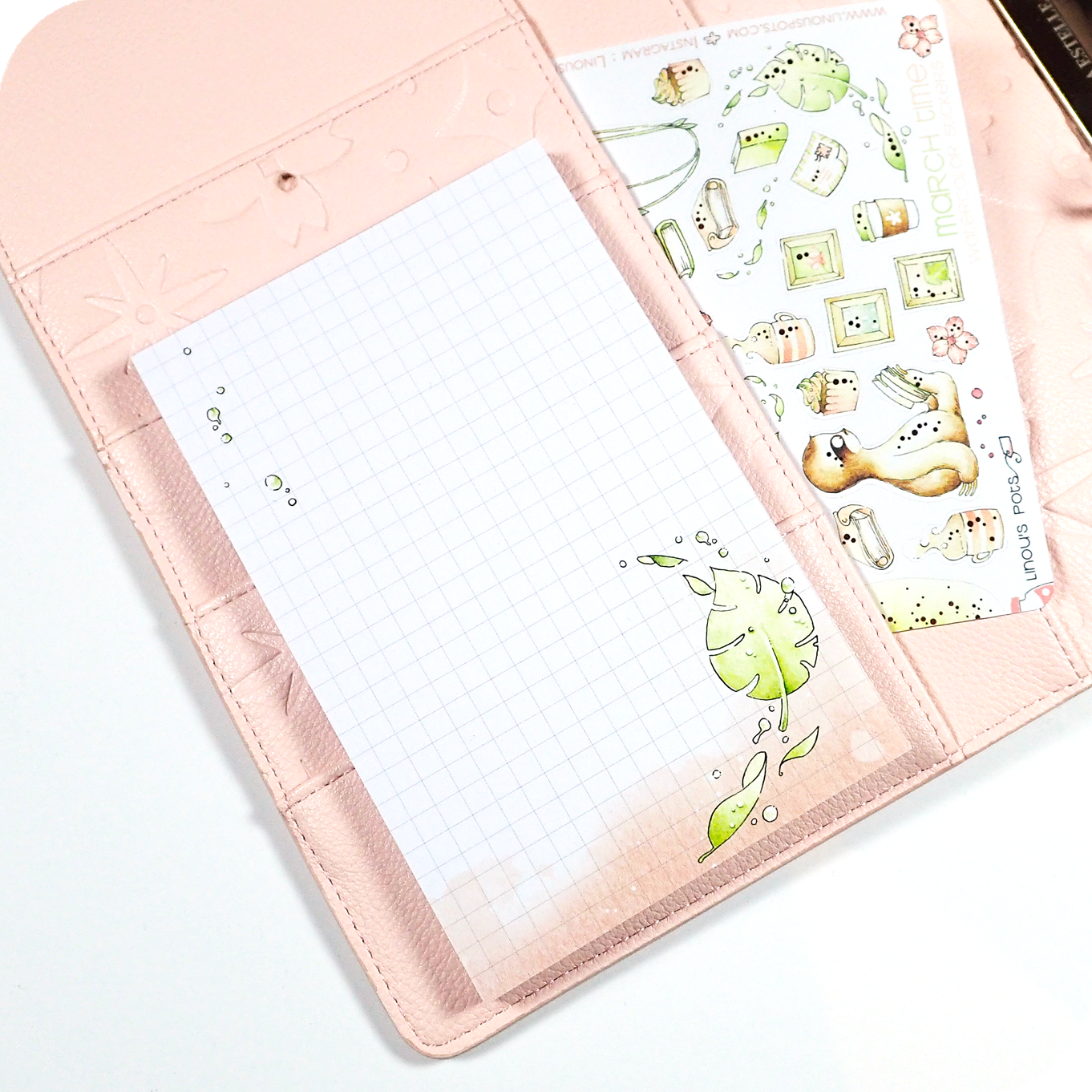Four watercolored grid notepads pocket sized