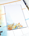 Four watercolored grid notepads pocket sized